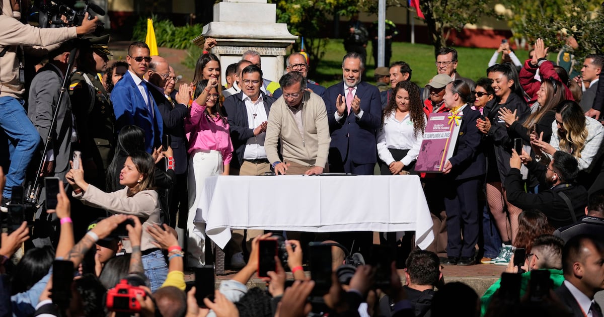 Colombia's president signs a labor overhaul into law after 2 failed attempts