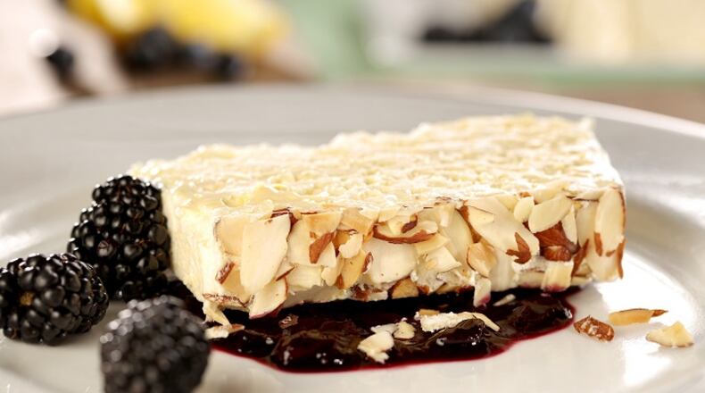 Fresh lemon juice and plenty of zest flavor a semifreddo served with a summer berry compote. (Michael Tercha/Chicago Tribune/TNS)