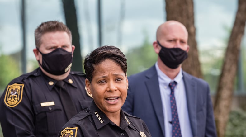 DeKalb County Police Chief Mirtha Ramos, at podium, leads a press conference Thursday, March 18, 2021 announcing the reunion of 1-year-old Royalty Grisby with her mother after the child was taken by a 14-year-old in a stolen car 12 hours earlier. (Jenni Girtman for The Atlanta Journal-Constitution)