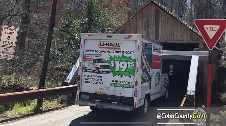 Cobb County Commissioners have approved a contract to install traffic signal mast arms that will suspend PVC pipes to warn vehicles about the Concord Road covered bridge's seven-foot clearance.