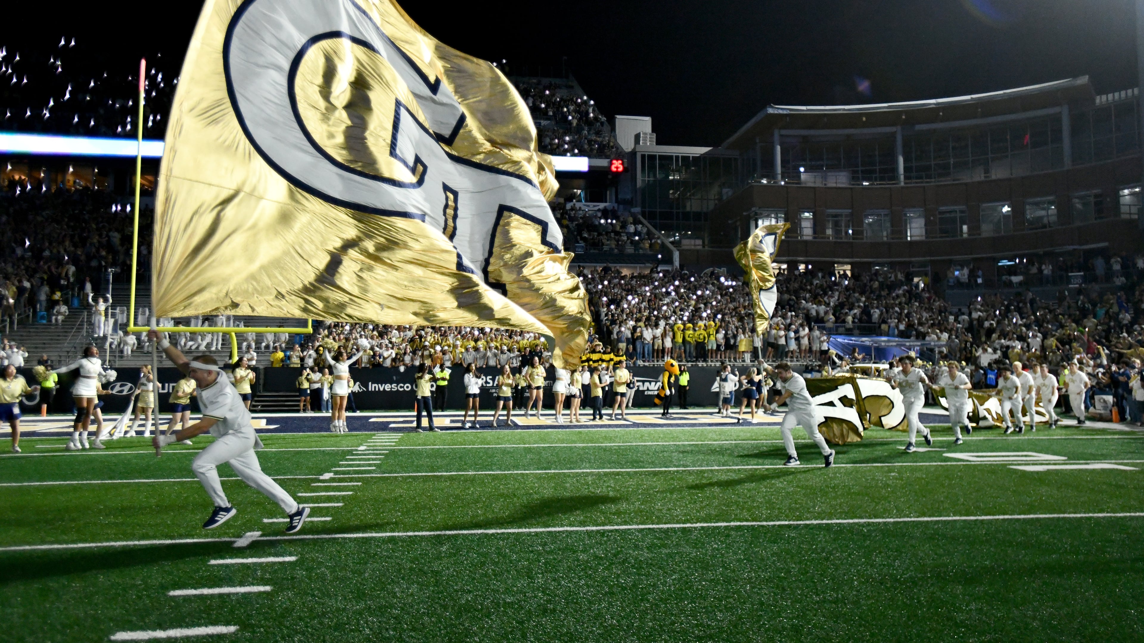 Georgia Tech's Ramblin' Wreck leads the band, cheerleaders, Buzz, players, and coaches before the start of the final regular-season home game against Pittsburgh at Bobby Dodd Stadium, Saturday, November 22, 2025 in Atlanta. (Hyosub Shin/AJC)