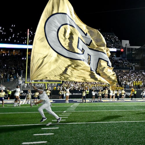 Georgia Tech's Ramblin' Wreck leads the band, cheerleaders, Buzz, players, and coaches before the start of the final regular-season home game against Pittsburgh at Bobby Dodd Stadium, Saturday, November 22, 2025 in Atlanta. (Hyosub Shin/AJC)