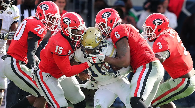 Linebacker Natrez Patrick (No. 6 in red) was one of two UGA players arrested Saturday night after the SEC championship game. Curtis Compton/ccompton@ajc.com
