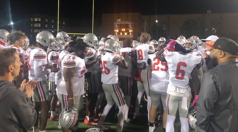 The Archer football team celebrates after its 22-19 win over South Gwinnett, Oct. 21, 2023 in Snellville.