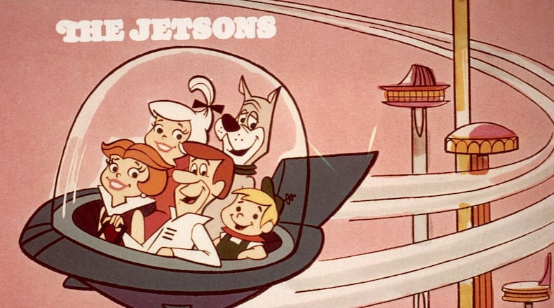 circa 1962:  Cartoon family the Jetsons, comprised of George, Jane, Judy, Elroy, and Astro, flying in a space car in a space age city, in a still from the Hanna-Barbera animated television show, 'The Jetsons'.  (Photo by Hulton Archive/Getty Images)