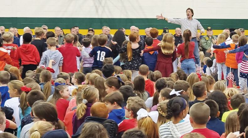 Avery Elementary School students, led by music teacher and Teacher of the Year David Boggs, perform special music for veterans at the annual Veterans Day program Nov. 11, 2019. The Cherokee County Schools, saying they may hire several hundred additional teachers, will hold a job fair Saturday, March 7, at River Ridge High School, Woodstock. CHEROKEE COUNTY SCHOOL DISTRICT