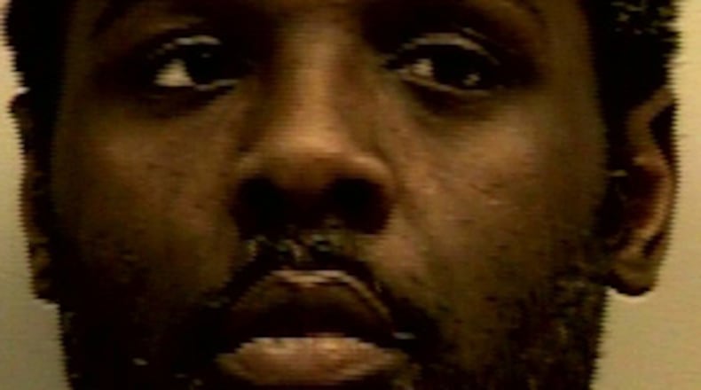 Police say Leevon Young opened fire Monday inside the Kroger on Grayson Highway in Lawrenceville. Young, 42, was arrested and charged with aggravated assault and gun possession, police said.