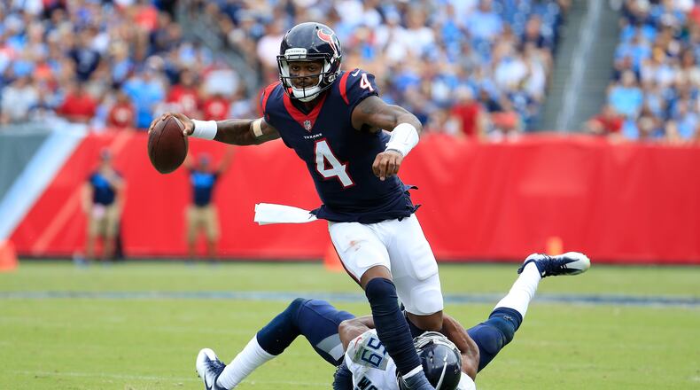 Deshaun Watson #4 of the Houston Texans runs with the ball against Wesley Woodyard #59 of the Tennessee Titans during the third quarter at Nissan Stadium on September 16, 2018 in Nashville, Tennessee.  (Photo by Andy Lyons/Getty Images)