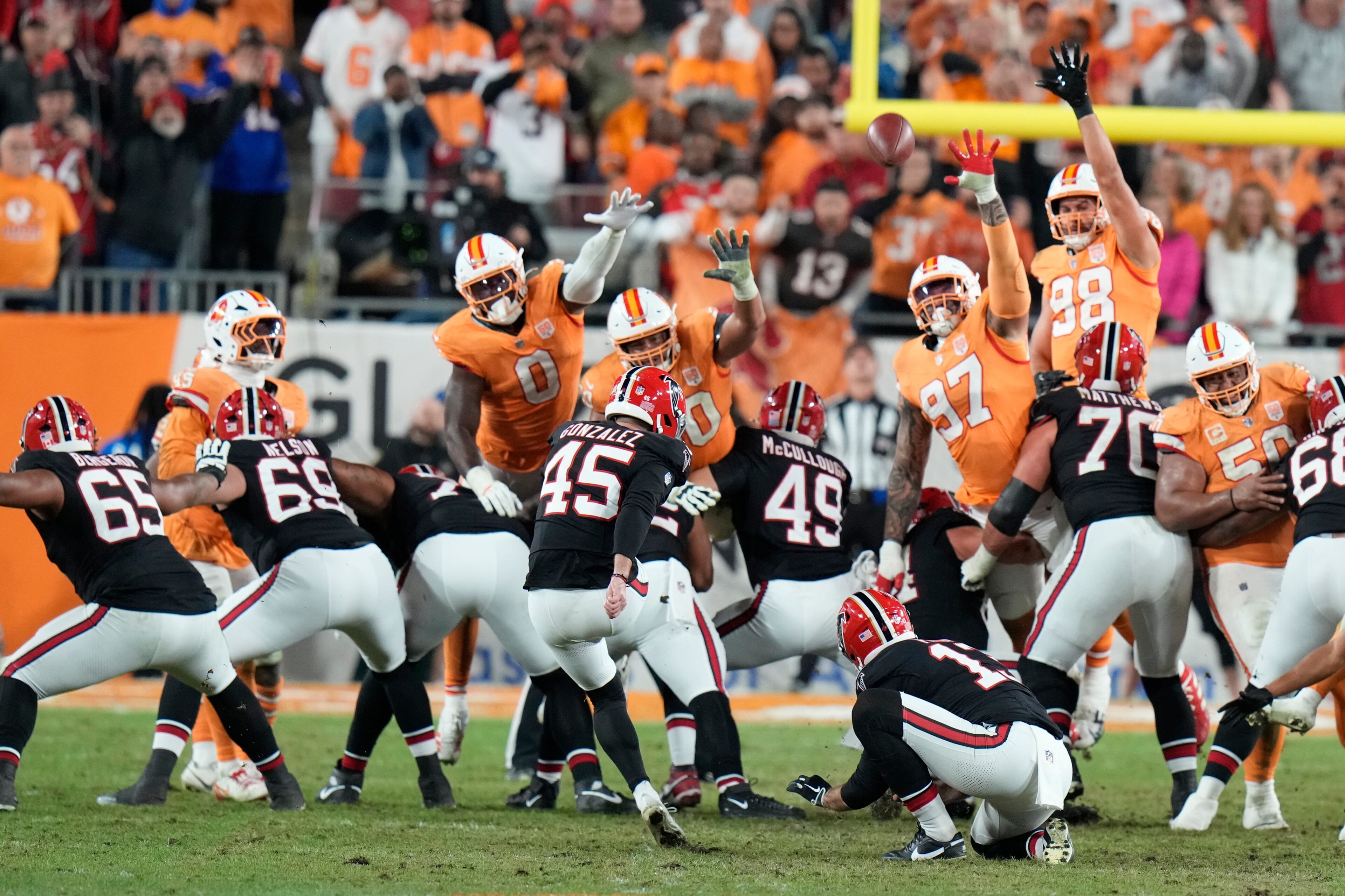 Atlanta Falcons place kicker Zane Gonzalez (45) kicks the game-winning field goal during the second half of an NFL football game against the Tampa Bay Buccaneers, Thursday, Dec. 11, 2025, in Tampa, Fla. (AP Photo/Chris O'Meara)