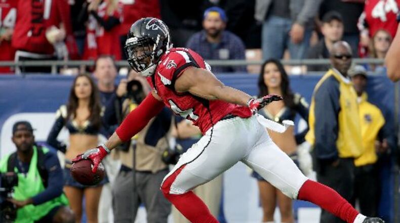 Falcons linebacker Vic Beasley celebrates on his way to scoring a touchdown after a fumble recovery against the Los Angeles Rams in the third quarter at the L.A. Memorial Coliseum Sunday. The Falcons defeated the Rams 42-14. (Jeff Gross/Getty Images)