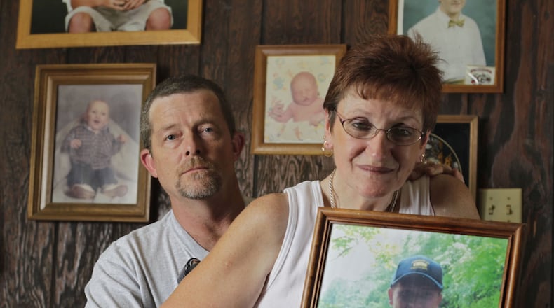 The Inman’s keep a wall of photos of Billy in their living room. Kathy Inman is holding the last photo taken of Billy. Billy and Kathy Inman’s son, Dustin, was killed in a motor vehicle accident in the year 2000. An illegal immigrant ran into their car in Ellijay, killing Dustin and their family dog. Kathy is still struggling with injuries sustained from the accident 11 years ago. She uses a wheelchair.