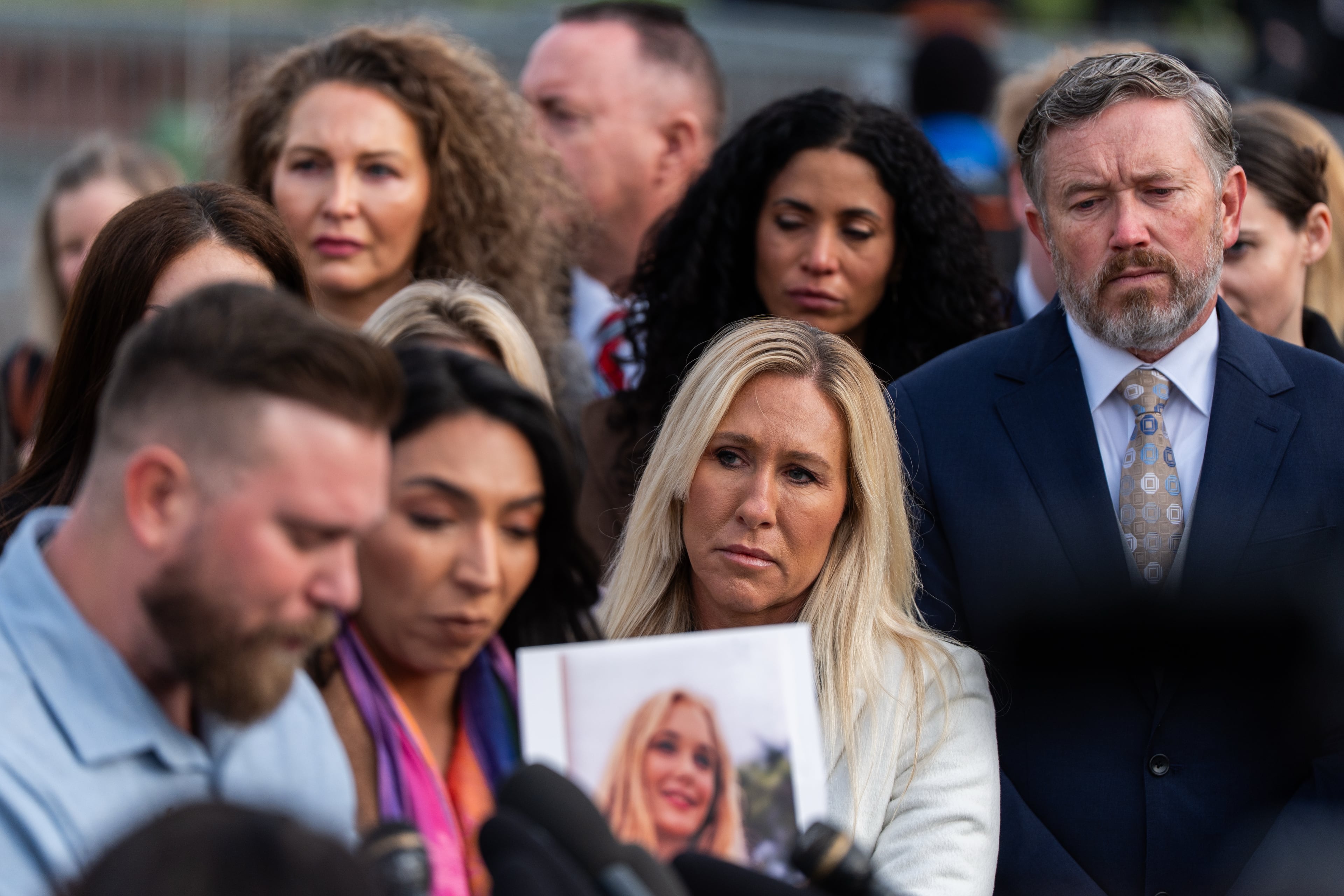 U.S. Rep. Marjorie Taylor Greene, R-Ga., second from right, and Rep. Thomas Massie, R-Ky., right, react during a news conference on the Epstein Files Transparency Act, Tuesday, Nov. 18, 2025, outside the U.S. Capitol in Washington. (Julia Demaree Nikhinson/AP)