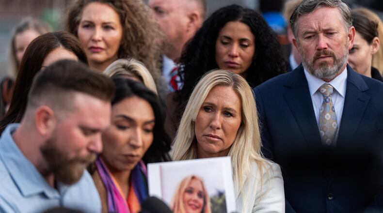 Rep. Marjorie Taylor Greene, R-Ga. (second from right) and Rep. Thomas Massie, R-Ky. (right) react during a news conference on the Epstein Files Transparency Act, Tuesday, Nov. 18, 2025, outside the U.S. Capitol in Washington. (Julia Demaree Nikhinson/AP)