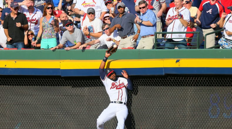 100512 ATLANTA: Atlanta Braves right fielder Jason Heyward (22) makes a leaping catch of St. Louis batter Yadier Molina's pop fly in the second inning of the National League wild card game at Turner Field in Atlanta on Friday, Oct. 5, 2012. CURTIS COMPTON / CCOMPTON@AJC.COM The man has a glove. And an arm. (Curtis Compton/AJC photo)