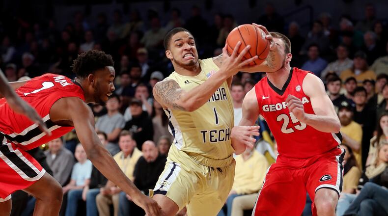 Georgia Tech guard Tadric Jackson (1) drives between Georgia’s Yante Maten (1) and Kenny Paul Geno (25) in the first half of an NCAA college basketball game Tuesday, Dec. 20, 2016, in Atlanta. (AP Photo/John Bazemore)