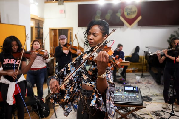 The Renaissance Orchestra strings section lead Annie Collins making beautiful music. 