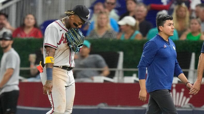 Atlanta Braves' Ronald Acuna Jr., front left, leaves the field during the seventh inning of a baseball game against the Miami Marlins, Friday, Sept. 15, 2023, in Miami. (AP Photo/Lynne Sladky)