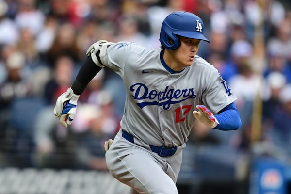 Los Angeles Dodgers' Shohei Ohtani runs after grounding out during the third inning of a baseball game against the Cleveland Guardians, Wednesday, May 28, 2025, in Cleveland. (AP Photo/David Dermer)
