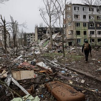In this photo taken on Saturday Dec. 20, 2025 and provided by Ukraine's 24th Mechanized Brigade press service, a soldier walks through the ruins of the town of Kostyantynivka, in the Donetsk region, Ukraine. (Oleg Petrasiuk/Ukraine's 24th Mechanized Brigade via AP)
