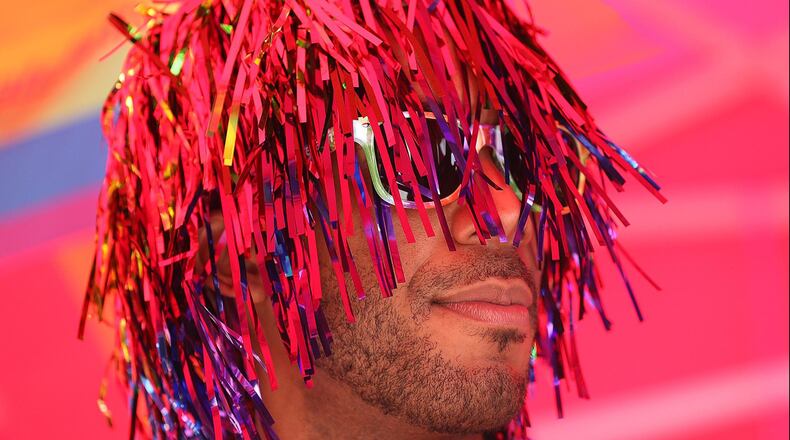 Christian Goodlette sports pride hair during the Pure Heat Community Festival, part of Black Pride Weekend at Piedmont Park. Curtis Compton /ccompton@ajc.com