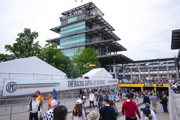 Fans make their way into the track before the start of the Indianapolis 500 auto race at Indianapolis Motor Speedway in Indianapolis, Sunday, May 25, 2025. (AP Photo/Michael Conroy)