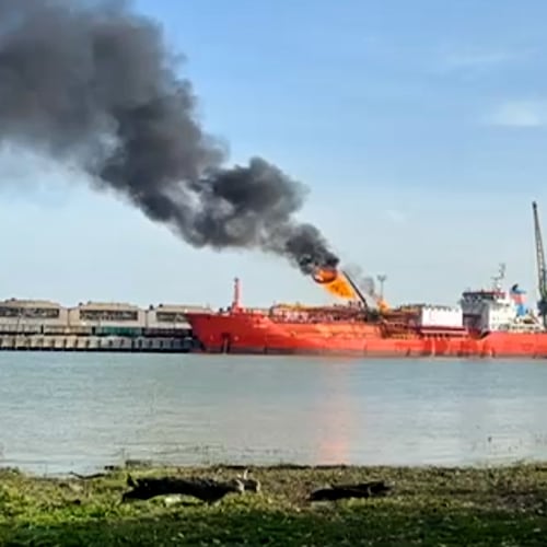 This image released on Monday, Nov. 17, 2025 by Romania's Emergency services, ISU, shot from the Romanian side of the border on the Danube river, shows a cargo ship loaded with liquified petroleum gas engulfed by flames following Russian strikes on Ukrainian port infrastructure in Izmail, Ukraine. (ISU Tulcea via AP)