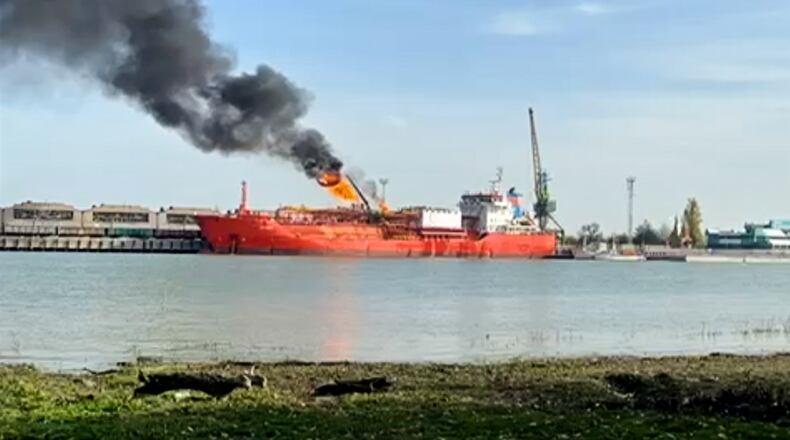 This image released on Monday, Nov. 17, 2025 by Romania's Emergency services, ISU, shot from the Romanian side of the border on the Danube river, shows a cargo ship loaded with liquified petroleum gas engulfed by flames following Russian strikes on Ukrainian port infrastructure in Izmail, Ukraine. (ISU Tulcea via AP)