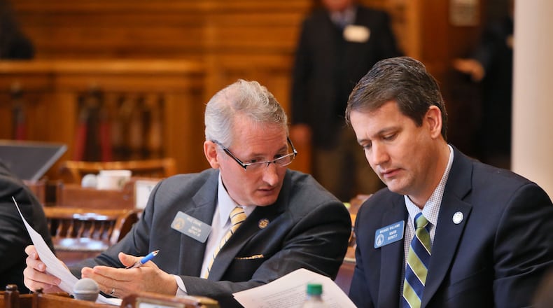 Sen. Mike Crane (left), R-Newnan, and Sen. Michael Williams, R-Cumming, confer in the statehouse. BOB ANDRES / BANDRES@AJC.COM