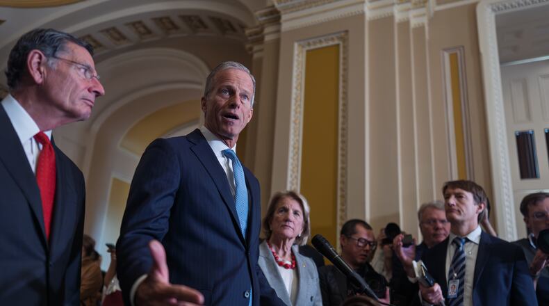 Senate Majority Leader John Thune, R-S.D., flanked by Sen. John Barrasso, R-Wyo., the GOP whip, left, and Sen. Shelly Moore Capito, R-W.Va., as he speaks with reporters after a closed-door GOP meeting at the Capitol in Washington, Wednesday, Nov. 19, 2025. (AP Photo/J. Scott Applewhite)