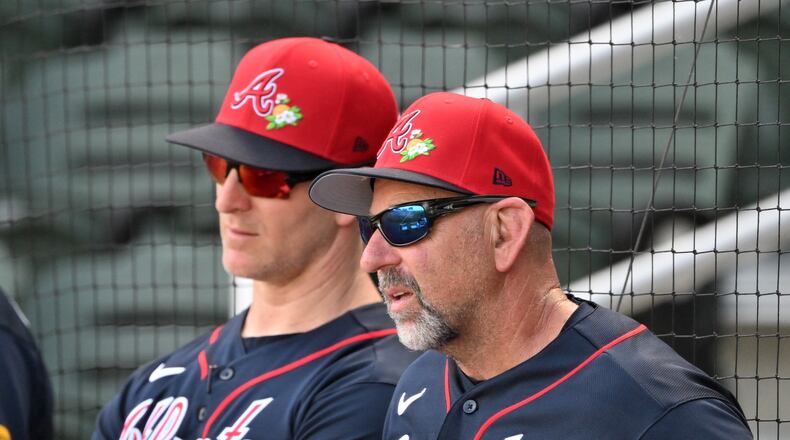 Atlanta Braves manager Walt Weiss (right) watches batting practice during spring training at CoolToday Park last month. (Hyosub Shin/AJC)