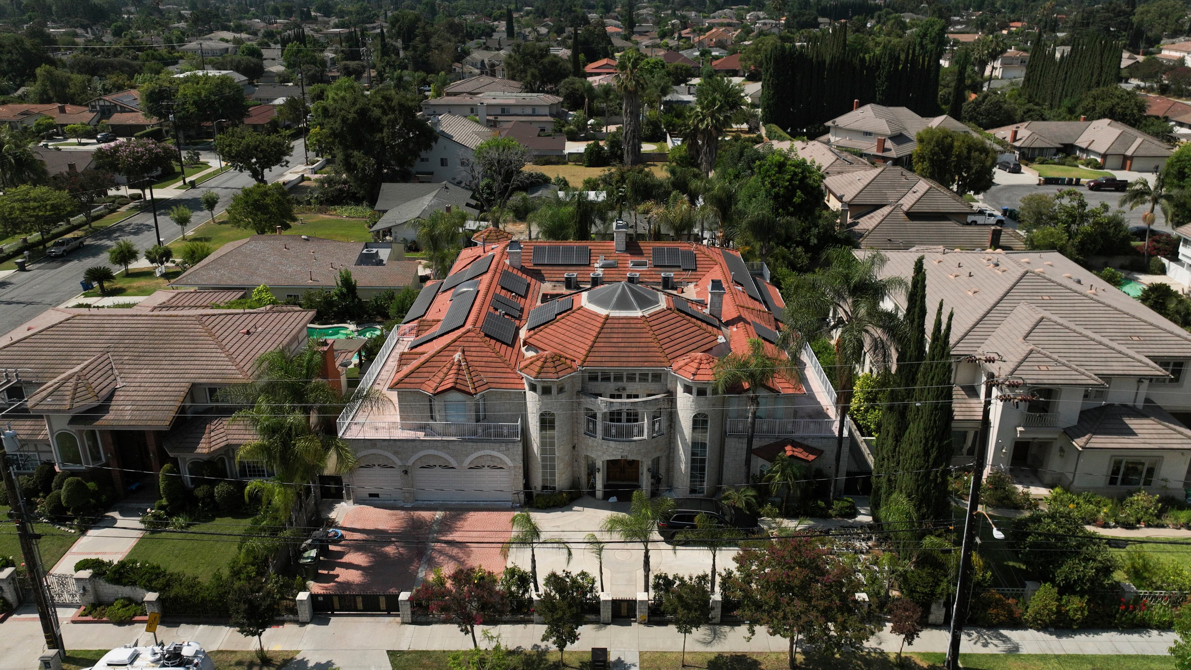 An aerial view shows the home of Silvia Zhang and Guojun Xuan on Wednesday, July 16, 2025, in Arcadia, Calif., where a number of children were removed from the couple's home after a child abuse allegation in May, according to Arcadia police. (AP Photo/Jae C. Hong)