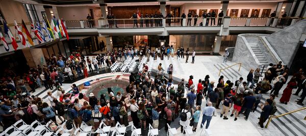 Crowds start to build inside the City Hall as the Council is set to give final approval to legislation that funds the training center.
Miguel Martinez /miguel.martinezjimenez@ajc.com
