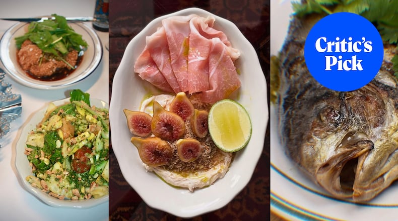 A triptych of vertical food photos, from left: a salad sits on a white tablecloth with a fried schnitzel plate behind it; an overhead shot of an oval plate with ham, figs cut into halves on a bed of chevre and a segment of lime; a close-up photo of the face of a whole, grilled fish. In the upper right-hand corner, a blue circle holds white lettering that reads "Critic's Pick."