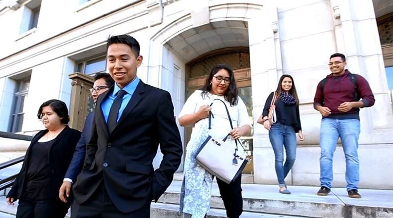 Plaintiffs in the legal dispute gathered outside the Fulton County Superior Court in December. MIGUEL MARTINEZ/MUNDO HISPANICO