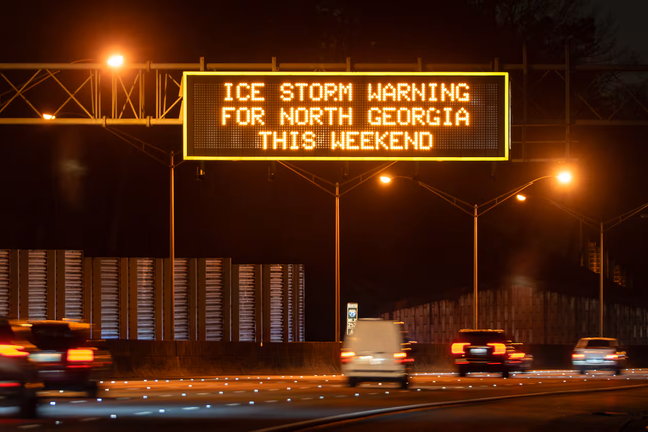 A Georgia Department of Transportation sign over I-75 Saturday Jan. 24, 2026, warns of the impending ice storm that will hit North Georgia this weekend. (Ben Hendren for the AJC)