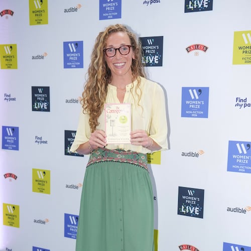 Virginia Evans holding her book The Correspondent, poses for a photograph at the 2026 Women's Prize Trust Summer Party & Awards Ceremony in London, Thursday, June 11, 2026. (AP Photo/Kin Cheung)