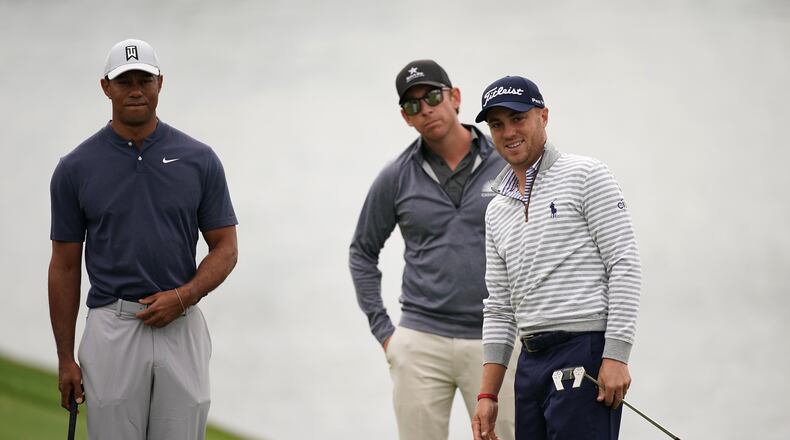Tiger Woods and Justin Thomas get in some quality time with putting coach Matt Killen during a practice round for The Players Championship Tuesday. (Photo by Richard Heathcote/Getty Images)