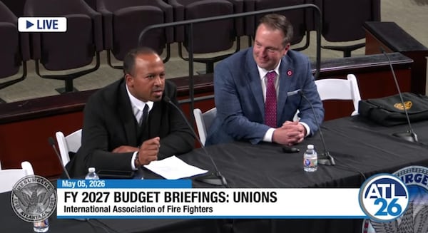 Capt. Alvin Rashad, president of the Atlanta Professional Fire Fighters Local 134, sits alongside former union president Nate Bailey (right) during a briefing for the department's upcoming budget. (Screenshot/City of Atlanta YouTube)