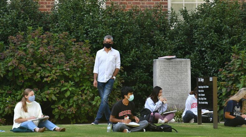 September 23, 2020, Athens - Class is taking place outdoor in the University of Georgia campus in Athens. The latest White House report on the coronavirus recommends Georgia take aggressive steps to test and quarantine college students to curb community spread. (Hyosub Shin / Hyosub.Shin@ajc.com)