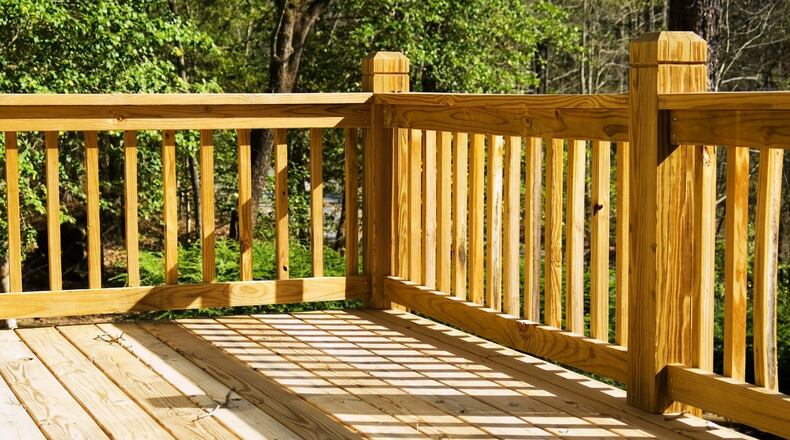 Bleaching a splintered deck will remove mold and prepare the surface for further treatment. (Dreamstime)