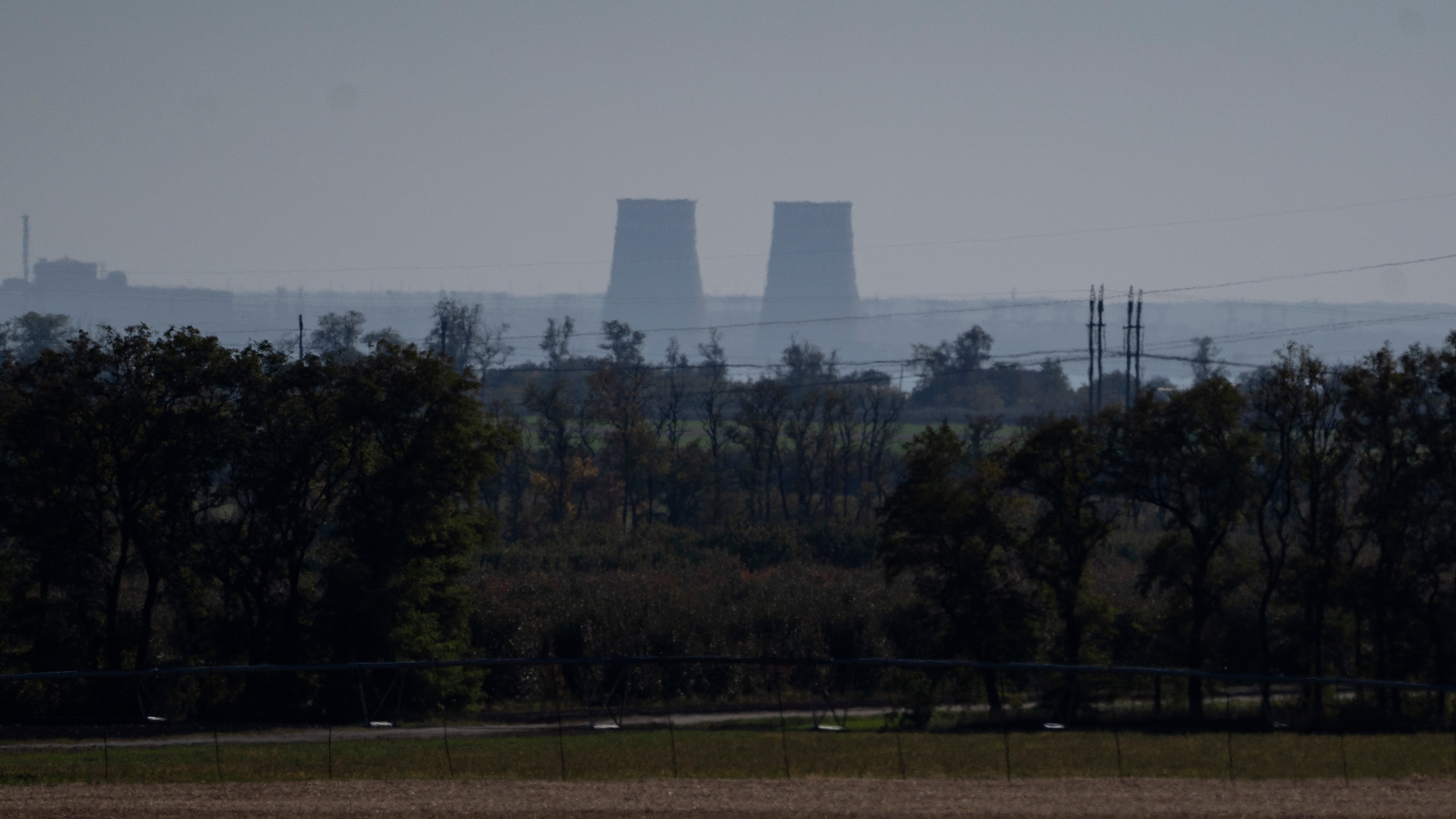 FILE - Zaporizhzhia nuclear power plant is seen from around twenty kilometers away in an area in the Dnipropetrovsk region, Ukraine, Monday, Oct. 17, 2022. (AP Photo/Leo Correa, File)