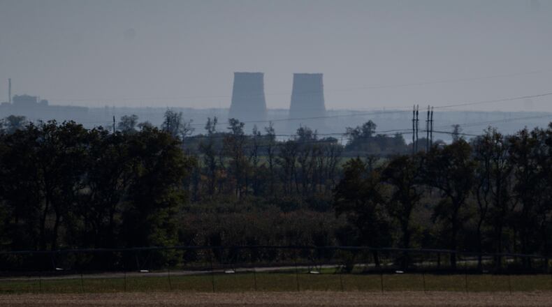 FILE - Zaporizhzhia nuclear power plant is seen from around twenty kilometers away in an area in the Dnipropetrovsk region, Ukraine, Monday, Oct. 17, 2022.  (AP Photo/Leo Correa, File)