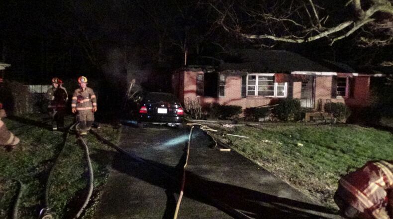 The home and a vehicle near the home were destroyed, and the side of a neighboring house was melted. (Credit: Gwinnett County Department of Fire and Emergency Services)