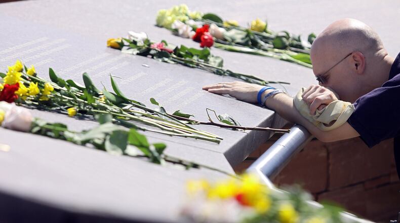 James Dann of Thornton, Colorado pauses at one of the names of the victims of the Columbine High School shootings on the ten-year anniversary at the Columbine Memorial Park April 20, 2009 in Littleton, Colorado. Dann was a DJ on a local radio station in Denver and said broadcasting that day was the "most difficult day of my career". Columbine was the site of the then deadliest school shooting in modern United States history when, on April 20, 1999, two shooters killed 12 students and one teacher, and wounded 23 others, before taking their own lives.