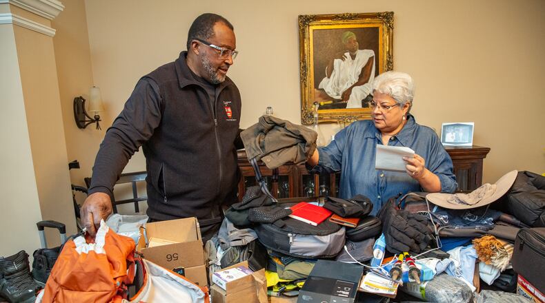 C. David Moody, Jr. prepares Wednesday, Jan 11, 2023 for his trip to scale Mount Kilimanjaro the highest mountain in Africa, located in Tanzania. His wife Karla Moody helps organize for the trip.  (Jenni Girtman for Atlanta Journal-Constitution)