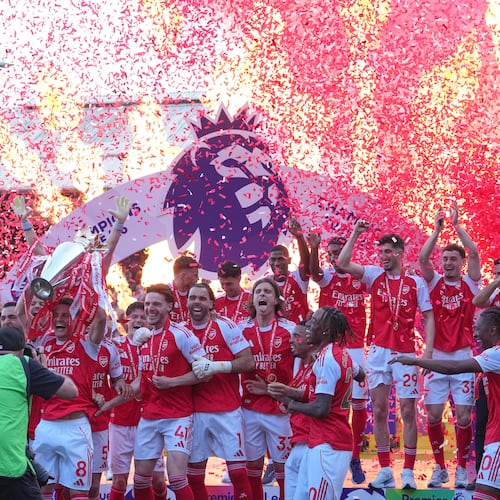 Arsenal players celebrate their Premier League title with the trophy after the English Premier League soccer match between Crystal Palace and Arsenal in London, England, Sunday, May 24, 2026. (AP Photo/Kin Cheung)