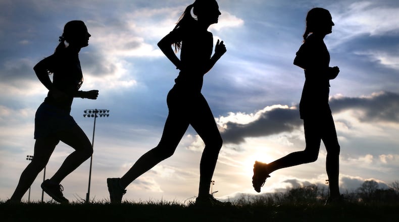 PRACTICE RUN--Millbrook High School girl's cross-country runners Nadia Dahimene, right, Hannah Croyle, center, and Mellany Groll practice for the postseason at the school in Frederick County, Va., Wednesday, Nov. 11, 2015. All three are previous state qualifiers. (Jeff Taylor/The Winchester Star via AP)