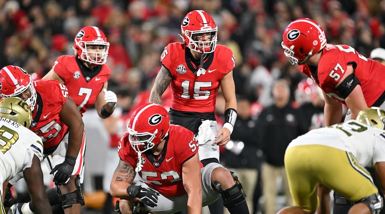 Georgia quarterback Carson Beck (15) shouts instructions during the first half in an NCAA football game at Sanford Stadium, Friday, November 29, 2024, in Athens. (Hyosub Shin / AJC)
