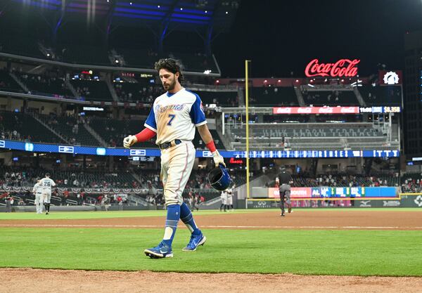 Braves shortstop Dansby Swanson (7) walks off field after 5-3 loss in the 10th inning to the Miami Marlins Monday, April 12, 2021, at Truist Park in Atlanta. (Hyosub Shin / Hyosub.Shin@ajc.com)