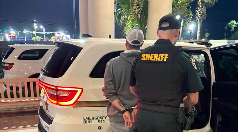 This photo provided by the Okaloosa County Sheriff's Office shows Christopher Gillum being arrested Wednesday, April 22, 2026, at a hotel in Destin, Fla. (Okaloosa County Sheriff's Office via AP)